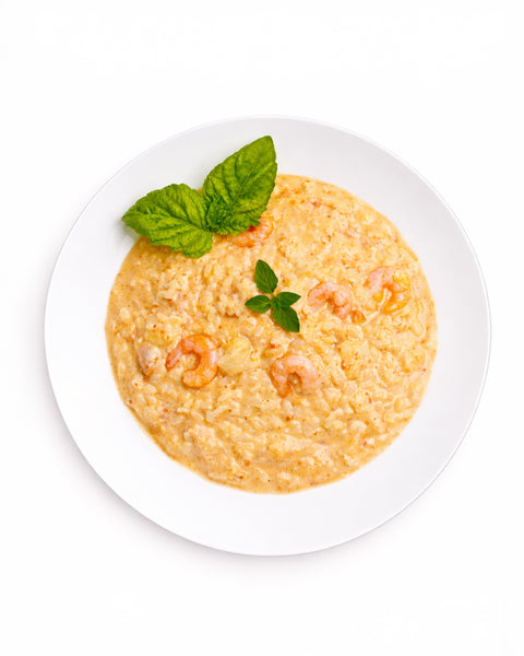 Risotto au pesto de tomates séchées, bisque de homard, crevette & ail confit